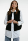 Embroidered women's vest "Petrykivka" black - bright ornaments on a classic background.