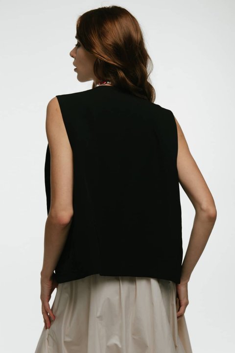 Embroidered women's vest "Petrykivka" black - bright ornaments on a classic background.