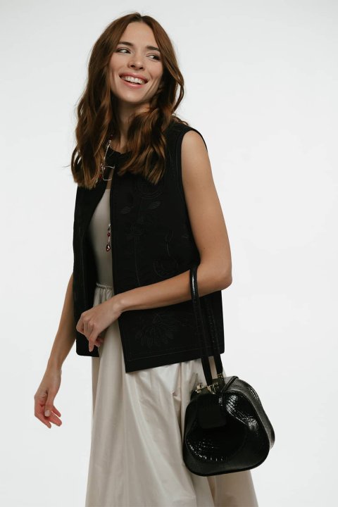 Embroidered women's vest "Petrykivka" black - bright ornaments on a classic background.