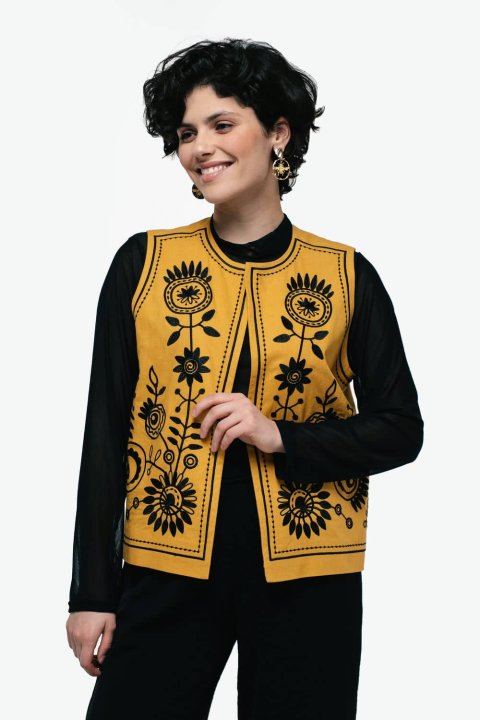 Embroidered women's vest "Petrykivka" ocher is a bright and stylish accent that combines tradition and modernity.