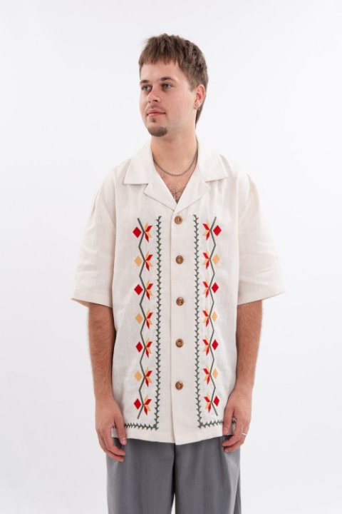 White embroidered men's jacket is a classic that emphasizes the purity of traditions